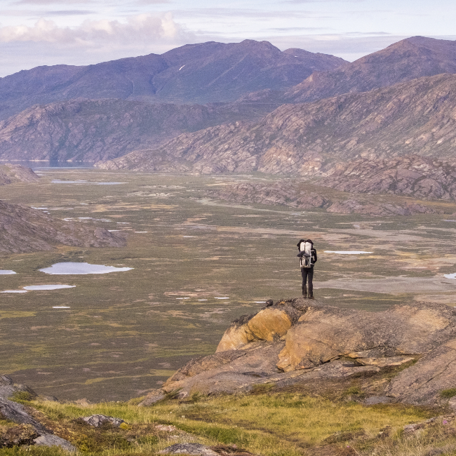 Arctic Circle Trail hiker looks into valley